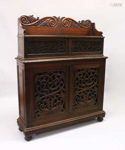 A 19TH CENTURY ANGLO INDIAN PADAUK WOOD CHIFFONIER, with carved back rail, over a pair of small
