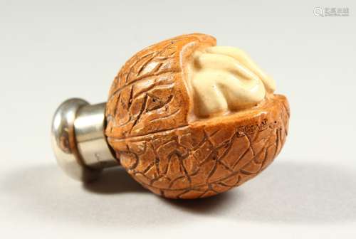 A NOVELTY WALNUT SHAPED SCENT BOTTLE BY SAMPSON MORDAN wirh plain silver top. London 1885. 5.5cms