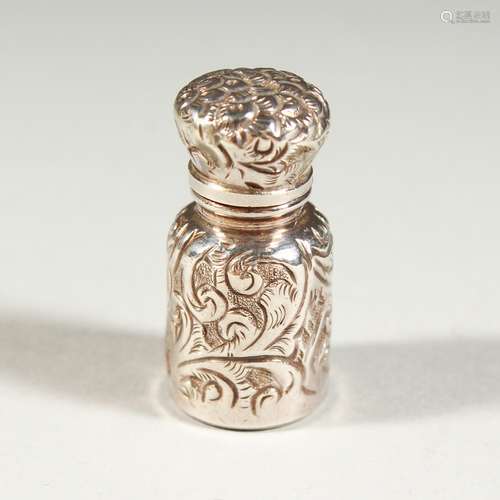 A SMALL VICTORIAN SCENT BOTTLE with floral repousse decoration. Birmingham 1889. Maker C. M. 3.25cms