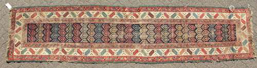 A PERSIAN CAUCASIAN RUNNER. 13ft x 2ft 11ins.