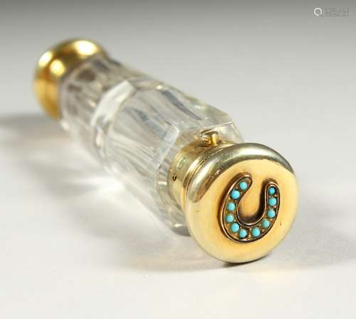 A GOOD VICTORIAN DOUBLE ENDED CUT GLASS SCENT BOTTLE with silve gilt mounts and horseshoe design,