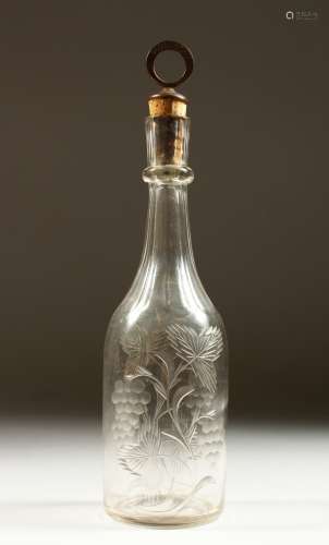 A GEORGIAN WINE BOTTLE AND STOPPER, engraved with fruiting vines. 28cms high.
