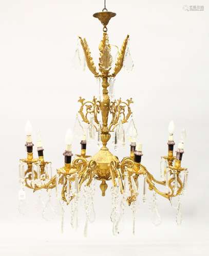 A LARGE LOUIS XVITH DESIGN GILT METAL EIGHT BRANCH CHANDELIER with over 200 cut crystal drops.