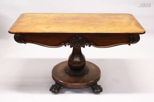 A VICTORIAN ROSEWOOD CENTRE TABLE,with rounded rectangular top, two frieze drawers, baluster