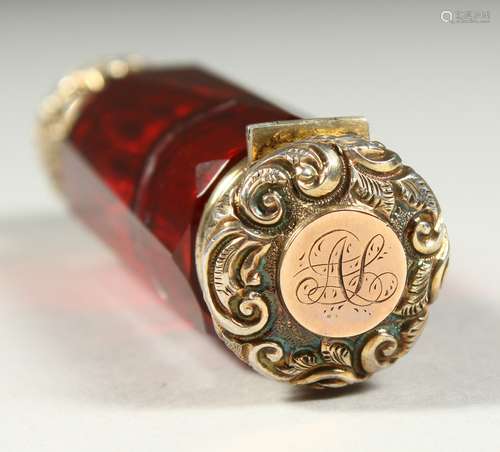 A VICTORIAN RUBY FACET CUT DOUBLE ENDED SCENT BOTTLE with screw off cap, the other end a