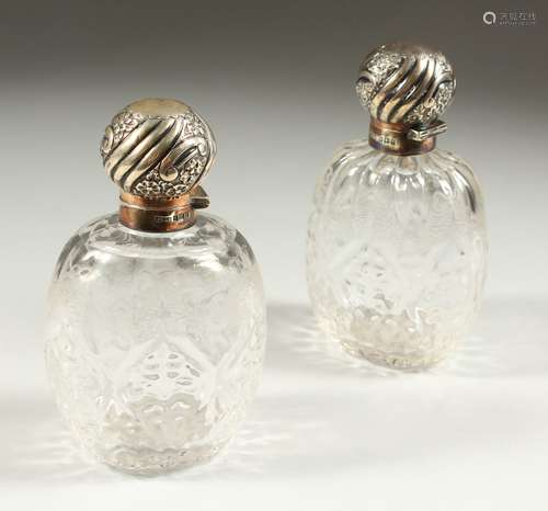 A SUPERB PAIR OF VICTORIAN STEVENS & WILLIAMS CYSTAL ENGRAVED AND MOULDED GLASS SCENT BOTTLES with