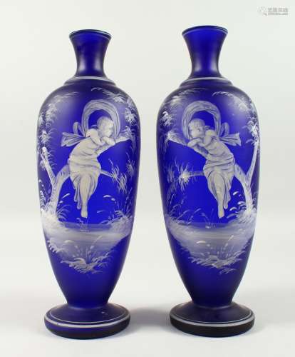A VERY GOOD PAIR OF MARY GREGORY RICH DARK BLUE VASES. Mirror images of a young girl on a branch.
