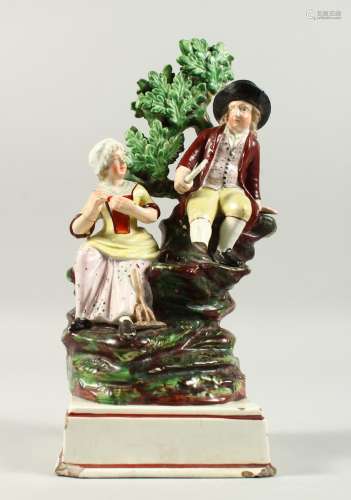 AN EARLY STAFFORDSHIRE Farmer and Wife. 11ins high.