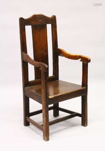 AN 18TH CENTURY OAK ARMCHAIR, with shaped cresting rail stamped with initials M W R N, plain