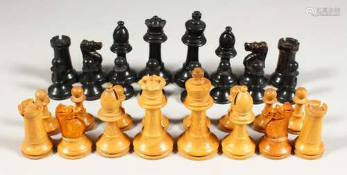 A BOXWOOD CHESS SET in a box.