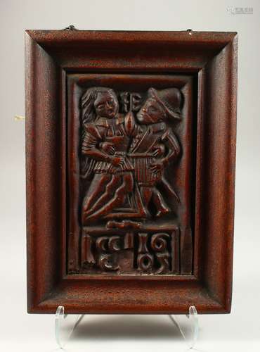 A 19TH CENTURY PLASTER PLAQUE with two figures dated 1605 in a wooden frame (see reverse) dated