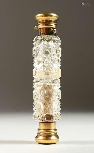 A GOOD VICTORIAN DOUBLE ENDED CUT GLASS SCENT BOTTLE with silver gilt mounts. London 1876. Maker