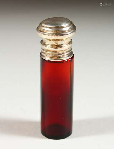 A PLAIN VICTORIAN RUBY GLASS SCENT BOTTLE with silver top. 8.5cms long x 2cms diameter.