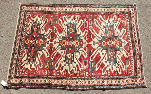 A RARE CAUCASIAN CHELEBERD RUG with Eagle design. 7ft x 4ft 10ins.