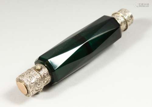 A VICTORIAN FACET CUT GREEN DOUBLE ENDED SCENT BOTTLE with engraved silver ends. 12.5cms long.