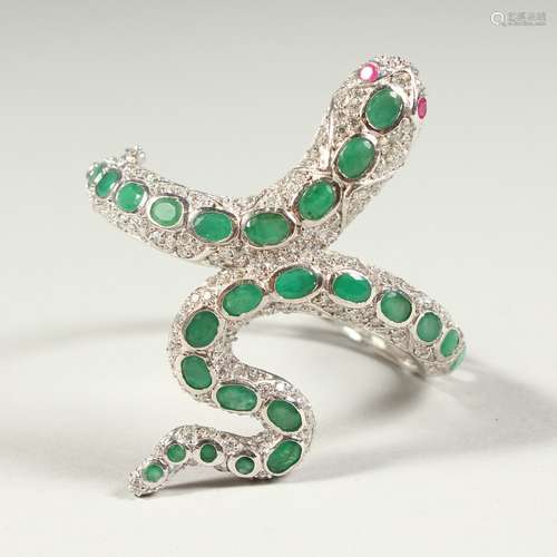 A SILVER AND REAL EMERALD SNAKE BANGLE with ruby eyes.