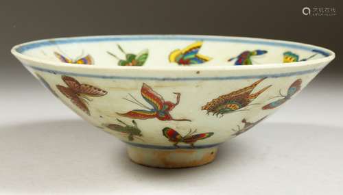 A CHINESE CIRCULAR PORCELAIN BOWL decorated with butterflies. 6.5ins diameter.