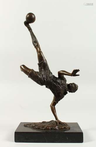 A BRONZE FOOTBALL FIGURE - Overhead Kick, on a marble base. 14ins high.