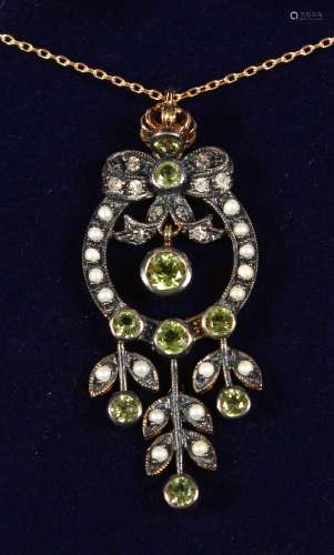 A 9CT GOLD AND SILVER PERIDOT, PEARL AND DIAMOND PENDANT on a chain, boxed.
