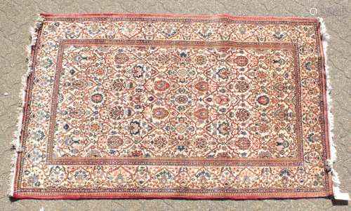 A LARGE PERSIAN KASHAN RUG with allover design on a cream ground. 4ft 2ins x 4ft 4ins.