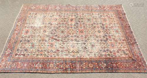 A LARGE PERSIAN KARAJA CARPET with seven central medallions in red and blue. 10ft 10ins x 7ft 4ins.