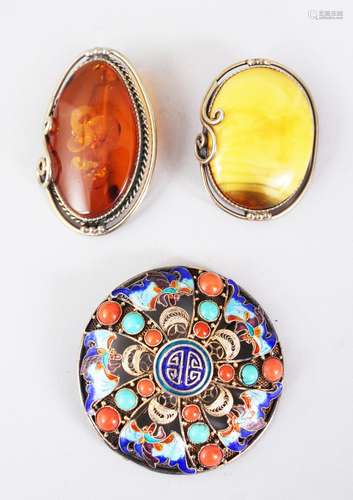 AN ENAMEL TORTOISESHELL AND CORAL BROOCH and two other brooches.