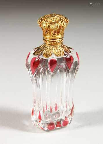 A,GOOD VICTORIAN GLASS AND SILVER GILT SCENT BOTTLE repousse with flowers and scrolls. 8.5cms long.