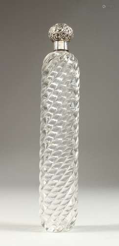 A LARGE 19TH CENTURY WRYTHEN FLUTED GLASS SCENT BOTTLE with screw off silver repousse cap.