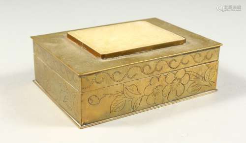A CHINESE BOX with hinged lid, set with a circular jade piece. 5ins long.