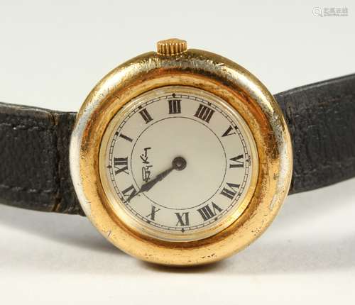 A ROY KING WRISTWATCH with a leather strap.