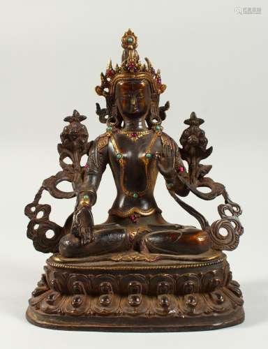 A CHINESE BRONZE GOD sitting cross legged, with gilt decoration. 9ins high.