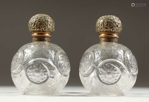 A SUPERB PAIR OF VICTORIAN STEVENS & WILLIAMS INTAGLIO CRYSTAL GLOBULAR SCENT BOTTLES AND