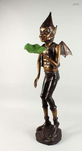 A LARGE BRONZE TWO COLOURED PIXIE.