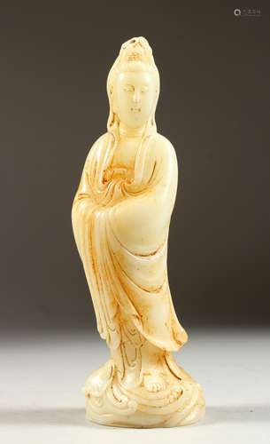 A CHINESE CARVED JADE FIGURE OF GUANYIN. 9ins high.