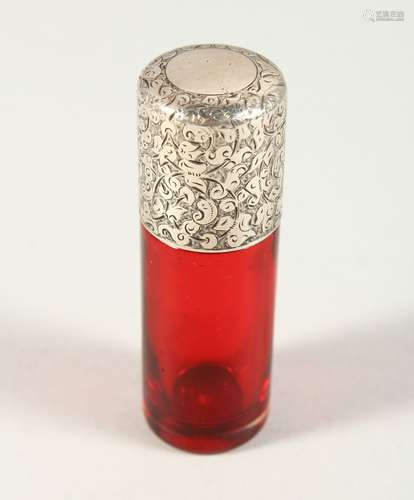 A VICTORIAN PLAIN RUBY GLASS SCENT BOTTLE with engraved silver screw off cap. London 1887. Maker