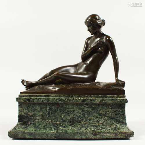 H. TANGLANG. A GOOD BRONZE OF A RECLINING NUDE on a marble plinth. Signed and dated 1924. 7ins