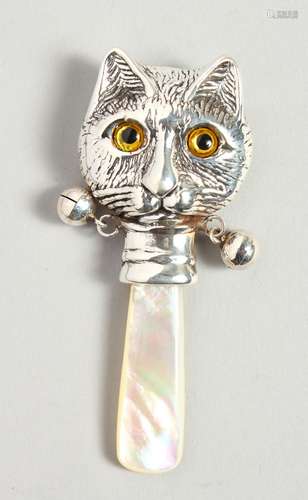 A NOVELTY SILVER AND MOTHER-OF-PEARL BABY'S RATTLE with a cat face.