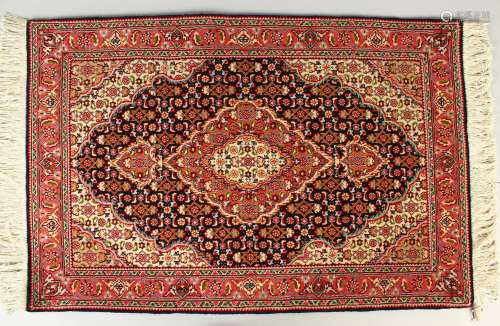 A GOOD SMALL PERSIAN PRAYER RUG, blue ground with allover stylised floral decoration. 90cm x 60cm.