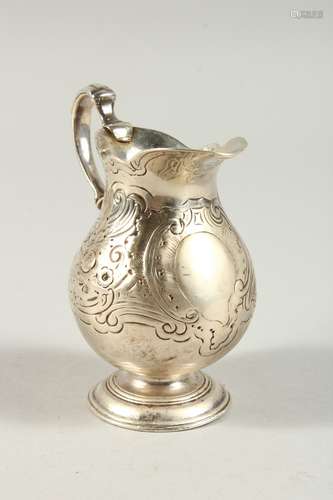 A GEORGE III CREAM JUG with scroll decoration. London 1783.