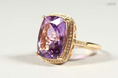 A 14k YELLOW GOLD AND DIAMOND RING set with a cushion cut purple amethyst.