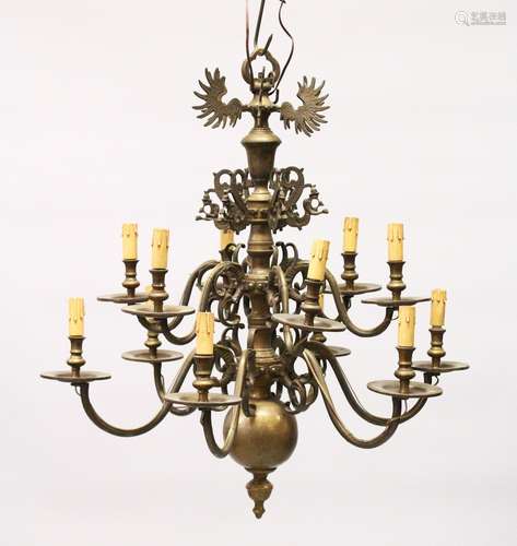 A GOOD DUTCH BRASS TWO TIER CHANDELIER with twelve scrolling branches. 2ft 6ins high x 2ft wide.