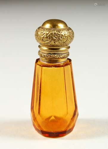 A SMALL VICTORIAN AMBER GLASS SCENT BOTTLE AND STOPPER. 6cms high.