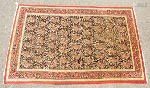 A VERY FINE PERSIAN QUM CARPET with silk foundation, a central pattern on a blue ground with fine