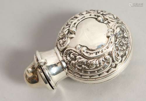 A VICTORIAN GREEN GLASS CIRCULAR SCENT BOTTLE AND STOPPER in a silver folding case. Chester 1900.