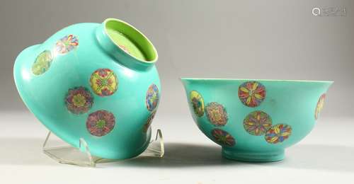 A PAIR OF CHINESE CIRCULAR BOWLS, green insides, the outsides with circular motifs. Impressed red