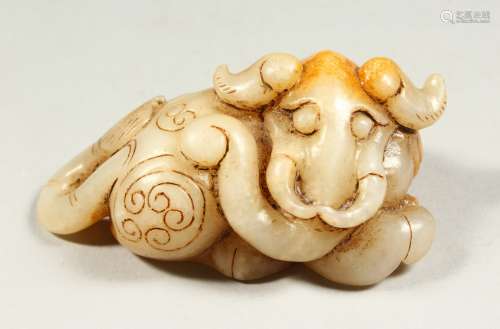 A CHINESE JADE CARVING OF AN ELEPHANT GOD. 3.5ins long.