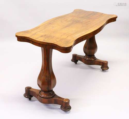 A 19TH CENTURY ROSEWOOD CENTRE TABLE, of shaped outline, with a baluster shaped column support to