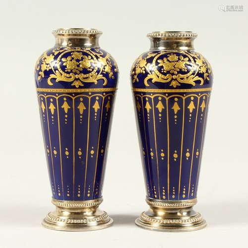 A GOOD PAIR OF 19TH CENTURY MINIATURE PORCELAIN VASES, possibly Sevres, deep blue ground with gilded