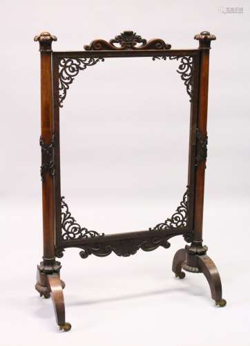 A VICTORIAN ROSEWOOD FRAMED FIRESCREEN with turned side columns (AF). 120cms high x 78cms wide.