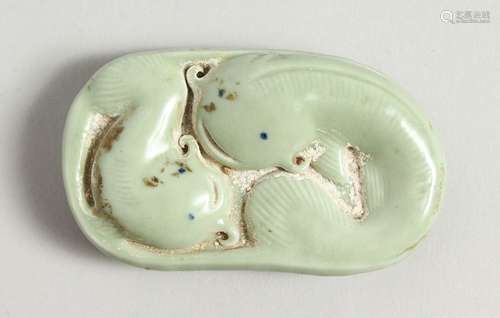 A CHINESE PORCELAIN DOLPHIN WEIGHT. 3cms long.